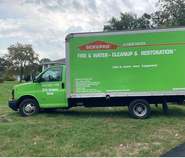 SERVPRO truck parked in customer's yard