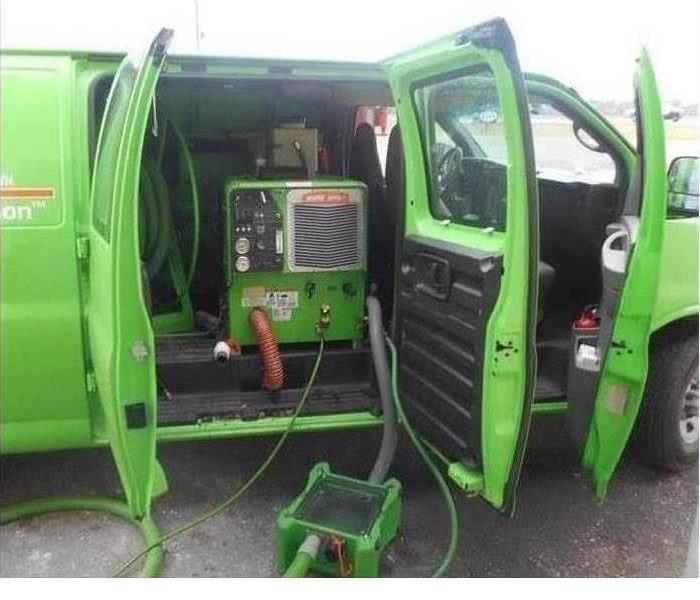 SERVPRO truck with a truck-mounted water extraction unit working