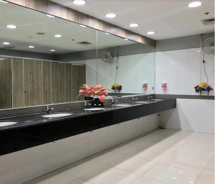 office bathroom with tile flooring