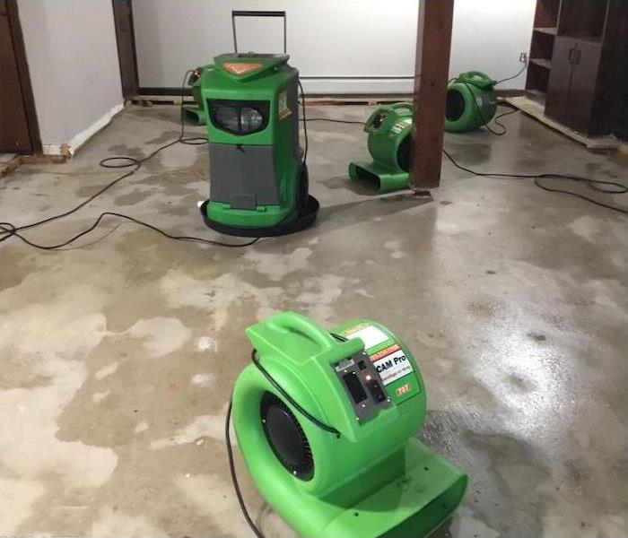 equipment on a concrete floor with water damage